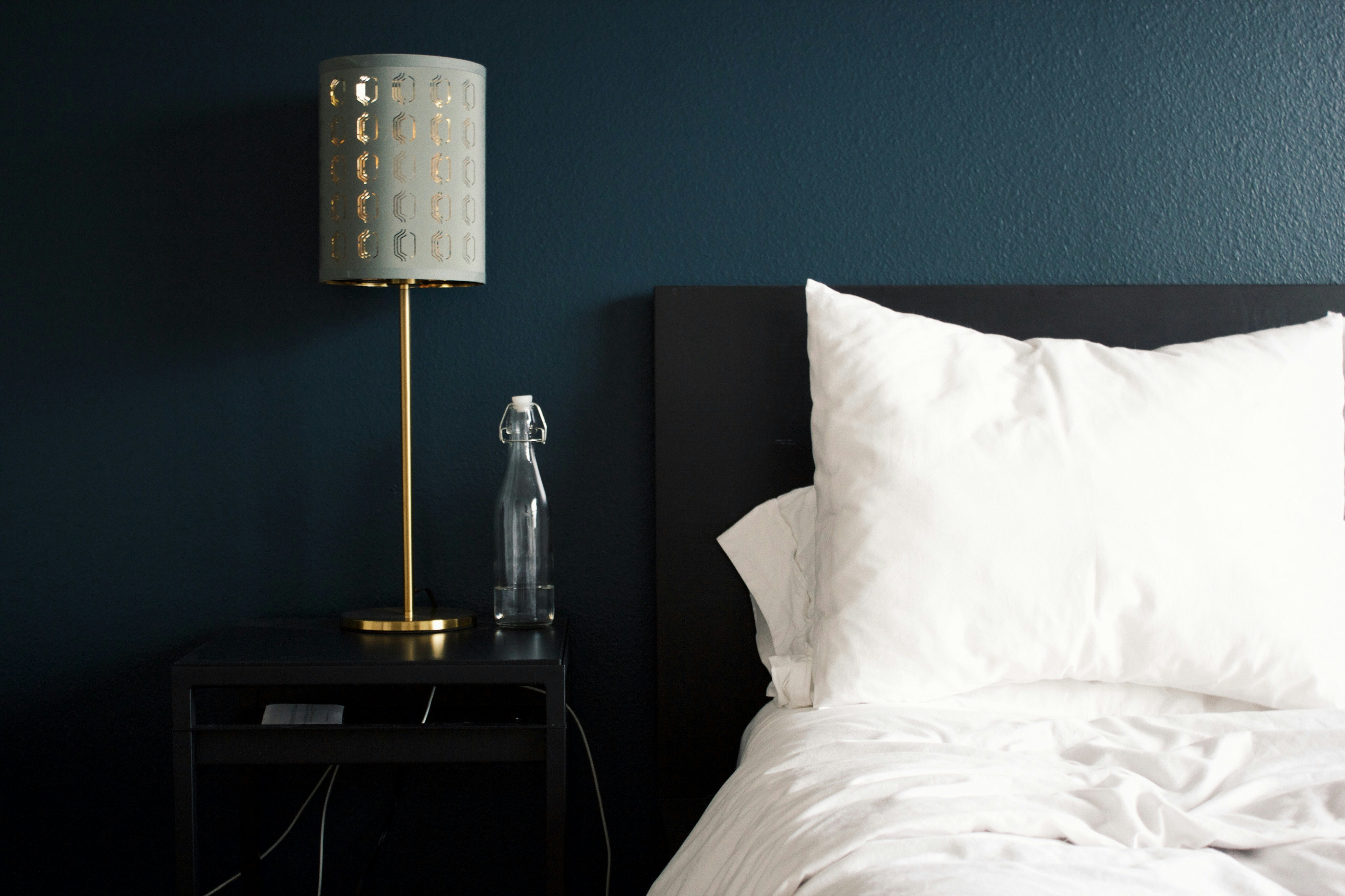 Bedside lamp and guest room detail